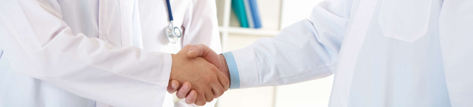 two doctors shaking hands
